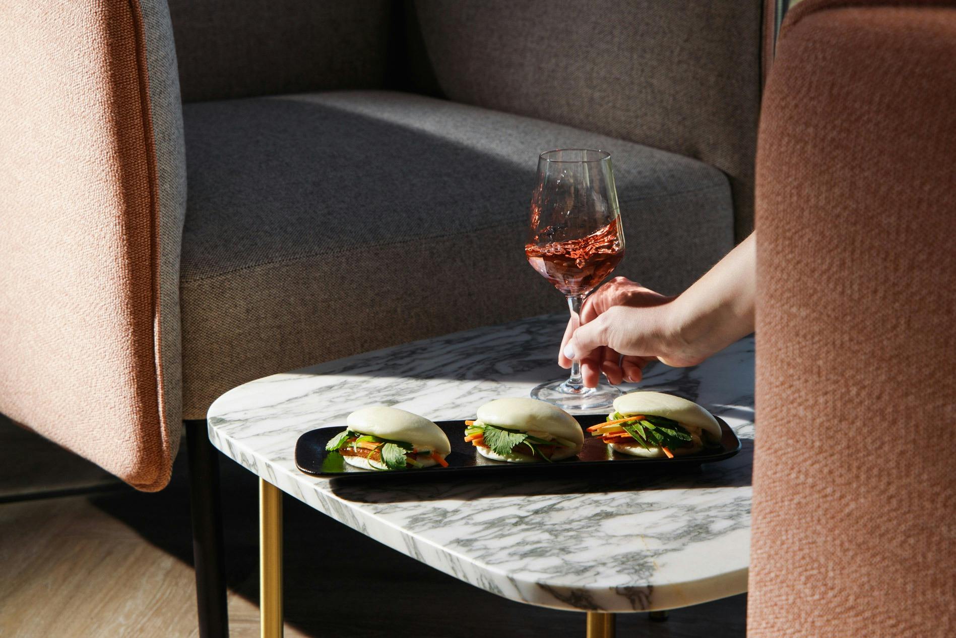 Sit back, take in the views and enjoy a glass of wine and Bao Bun at Luna10