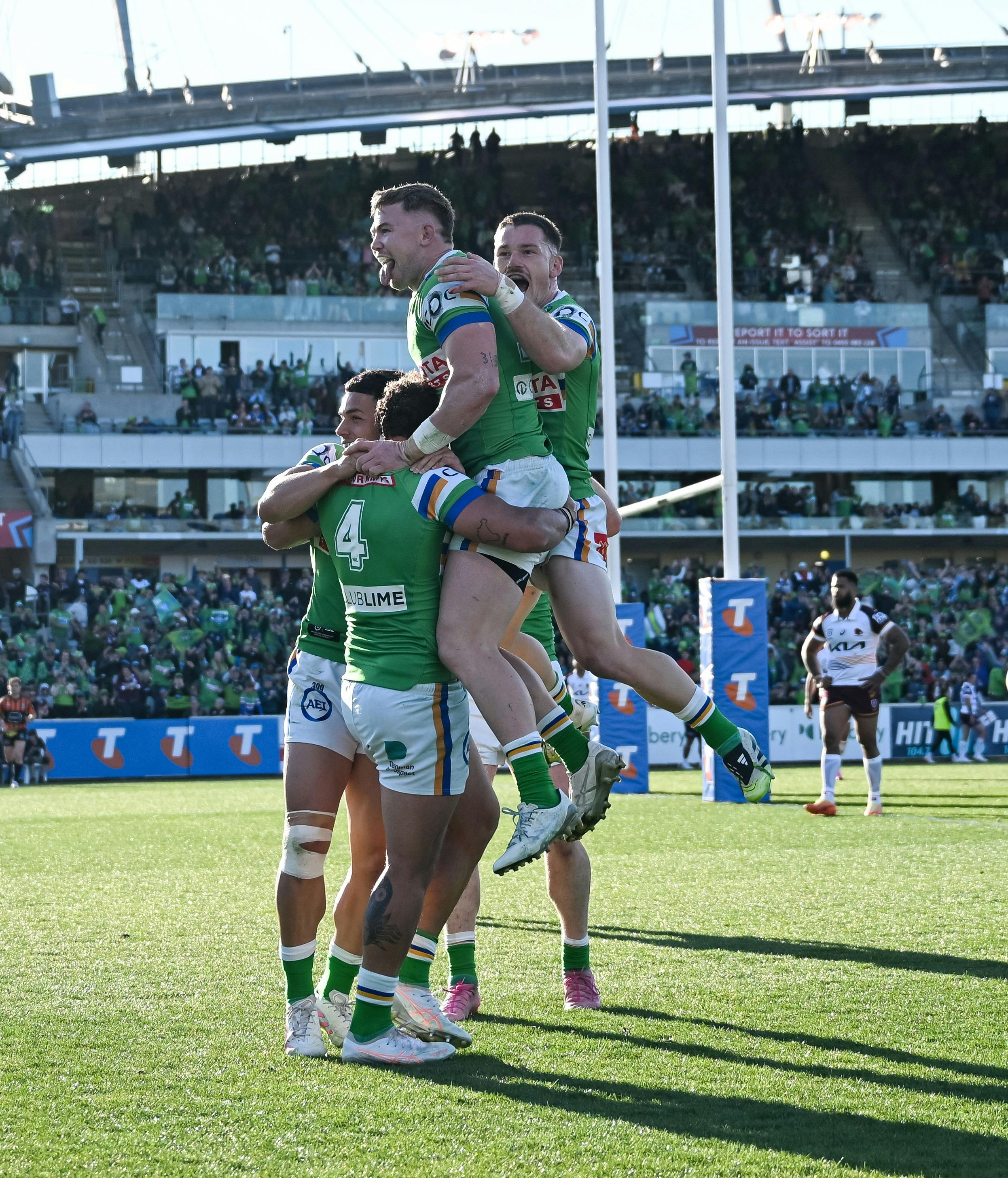 Canberra Raiders players celebrating a try.
