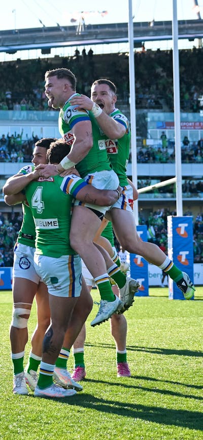 Canberra Raiders players celebrating a try.