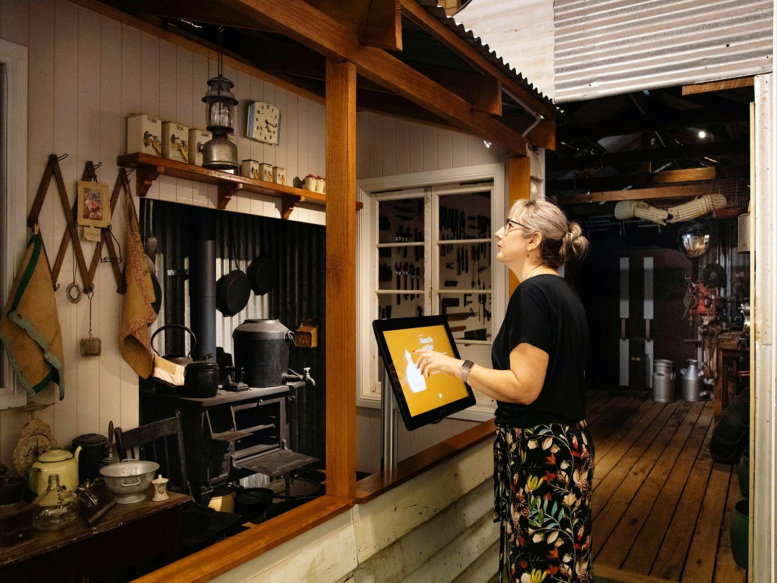 Lady looking at an exhibition display Lady looking at an exhibition display