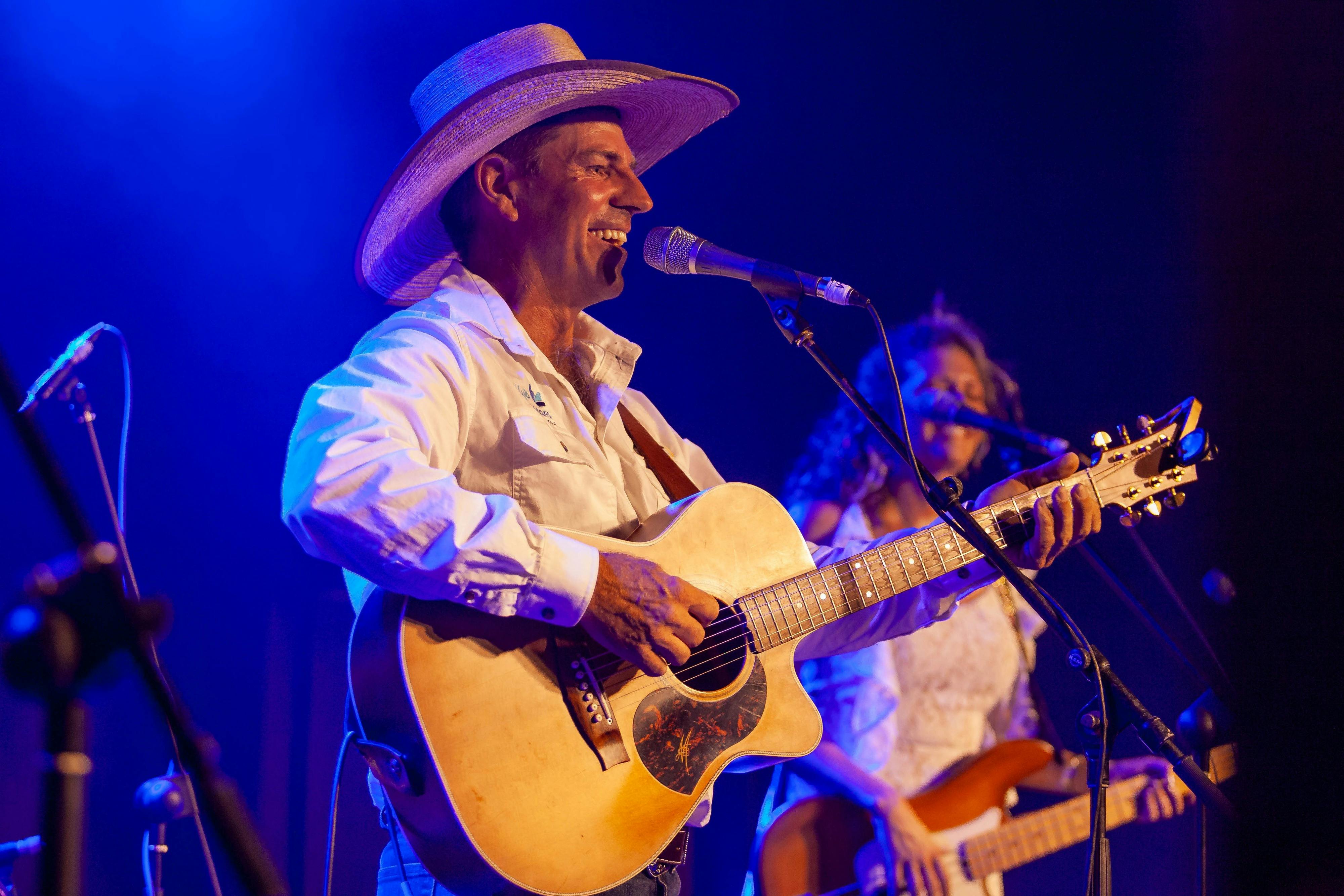Tom Curtain performing on stage