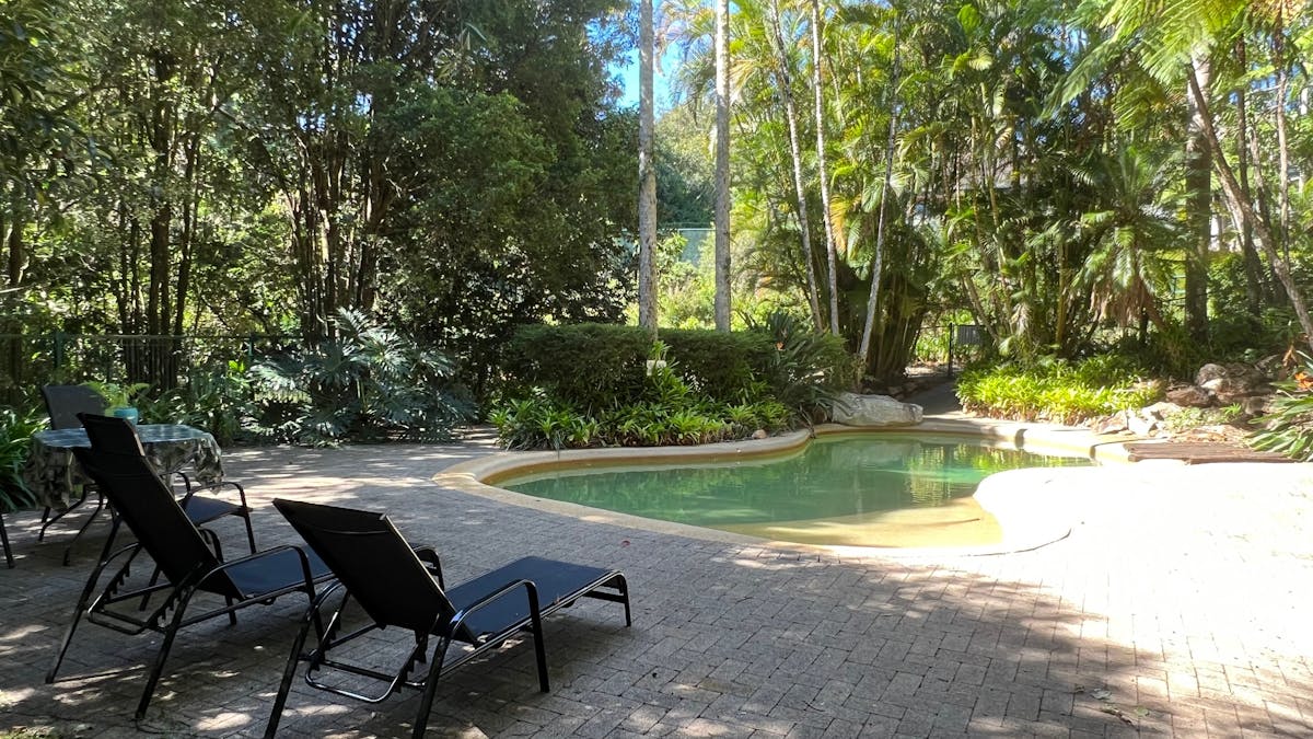 Pool lounges and small table setting provided for guests to self-cater by the pool.