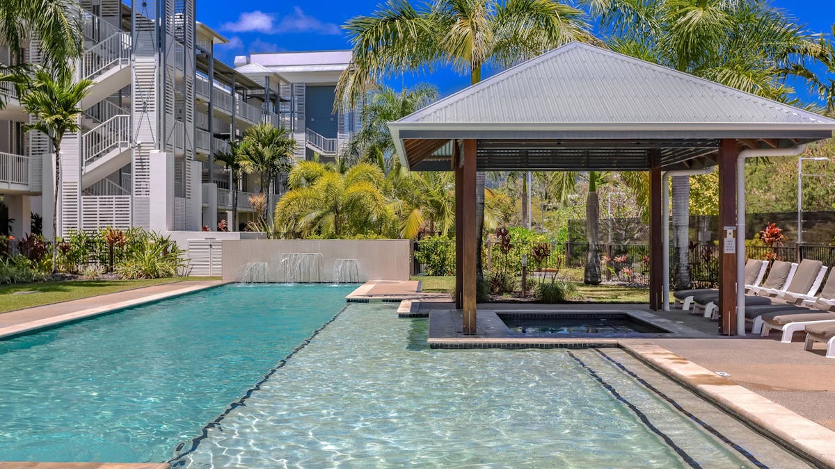 Swimming pool and hot tub for guest enjoyment, set in tranquil garden setting.