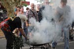 An Aboriginal elder performing a smoking ceremony