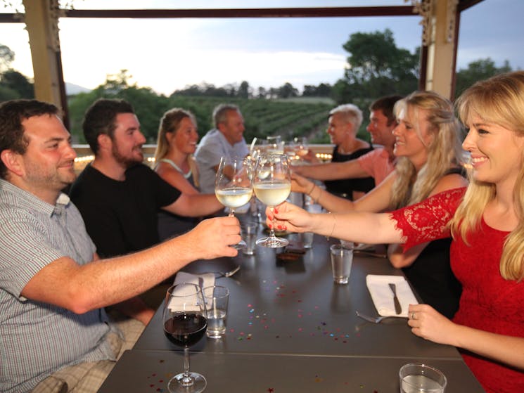 Guests enjoying a wine tasting with scenic outlook