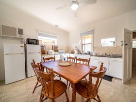The kitchen is spacious and has been outfitted with many useful appliances and utensils