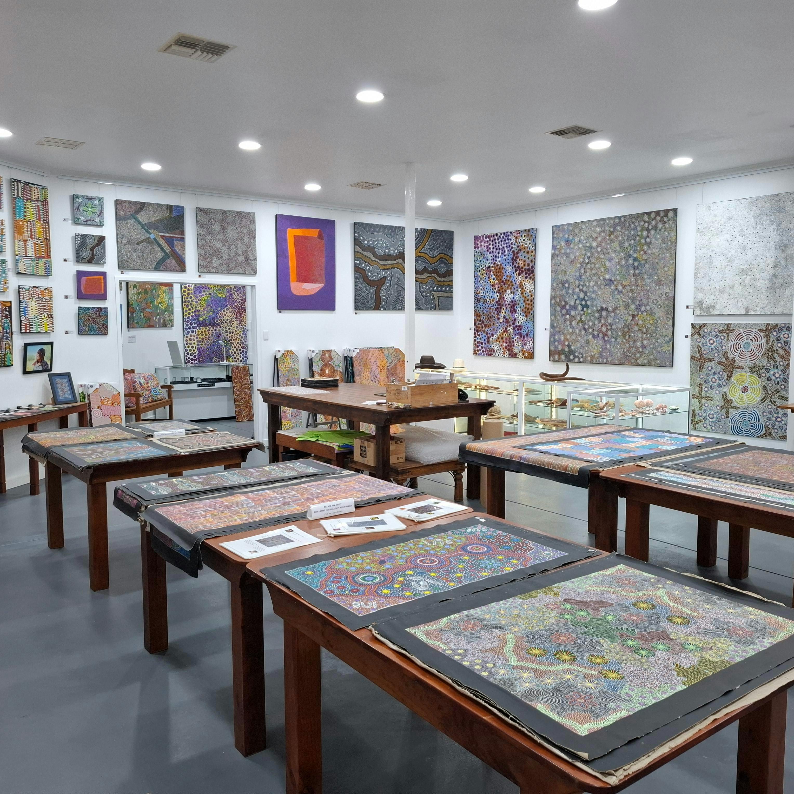 Loose paintings, artifacts, historic items, Zebra stone, wooden vases, artist feature wall.
