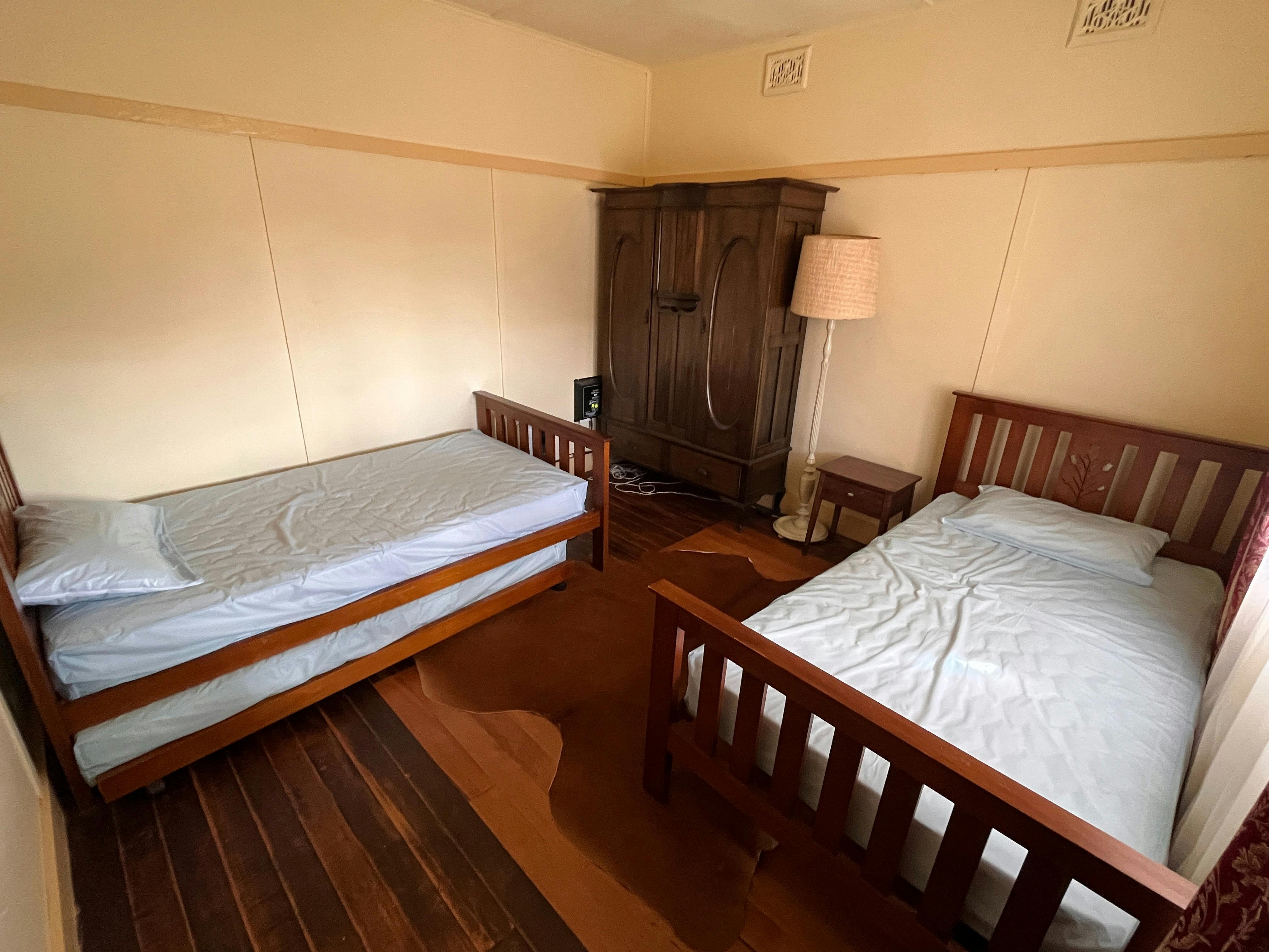 This room has 2 x king-single mattress and 1 x trundle bed with a single sized mattress.