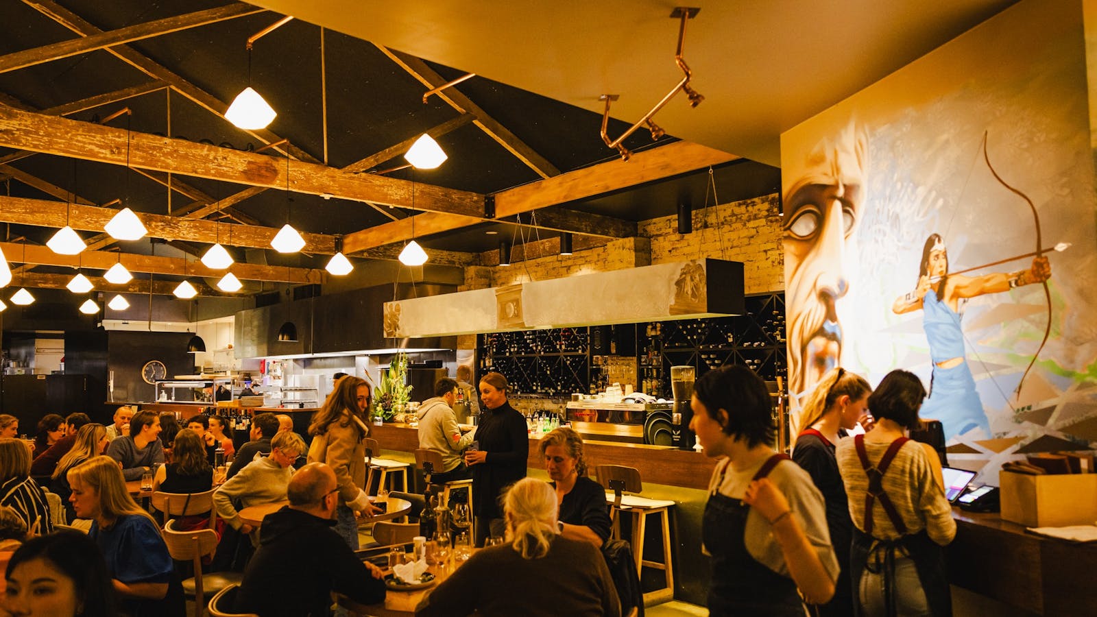 A lively evening inside Urban Greek, where guests enjoy shared dining and warm Greek hospitality.