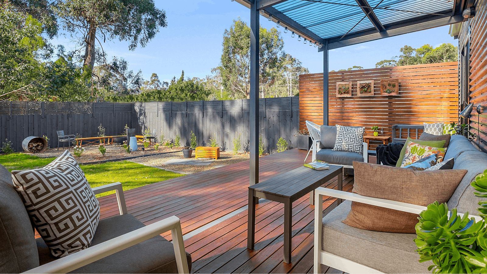 Generous, sun-drenched rear entertaining deck with BBQ, lounge, dining area & relaxation zones