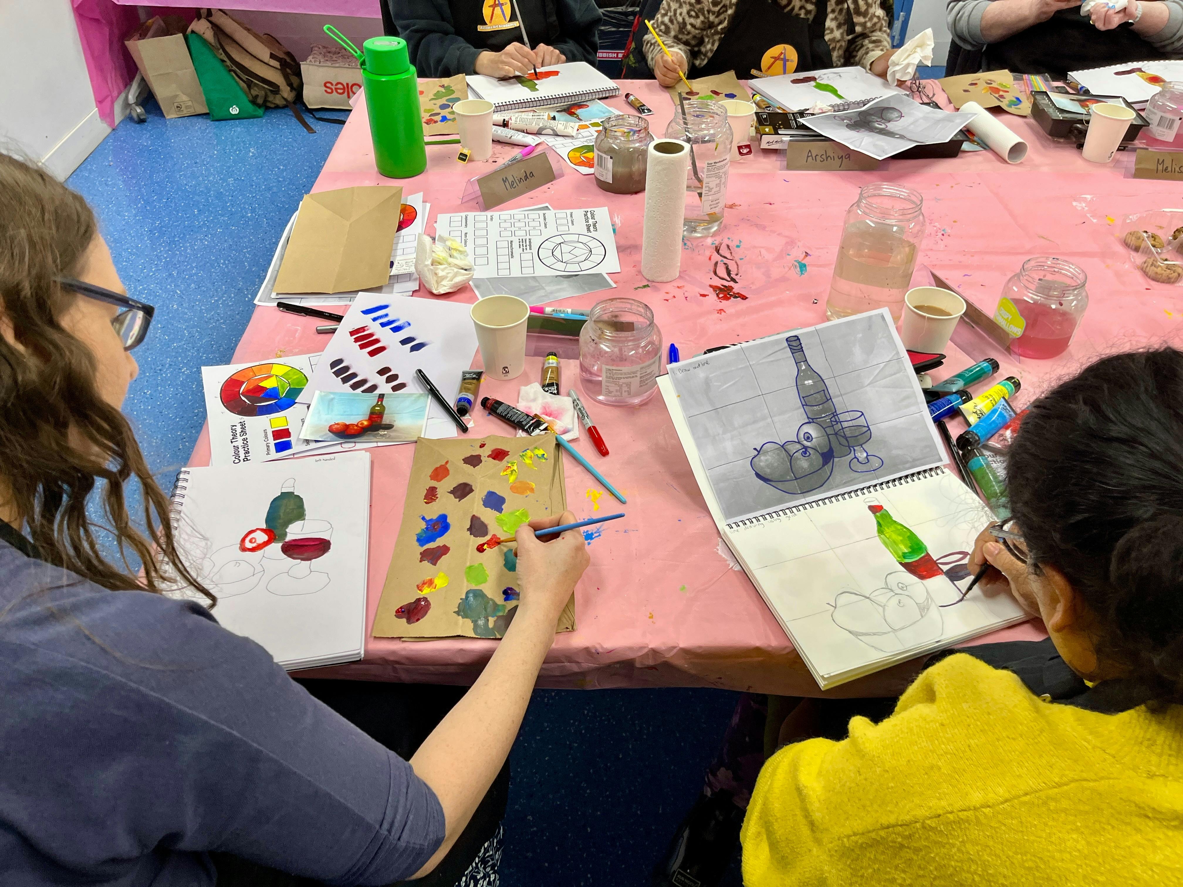 Paint and chat students painting together