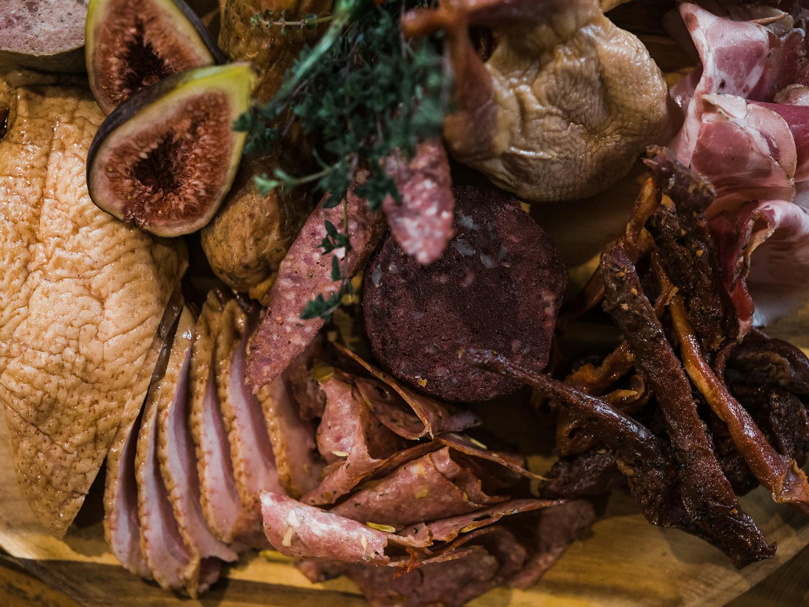Image shows platter of gourmet smallgoods meats
