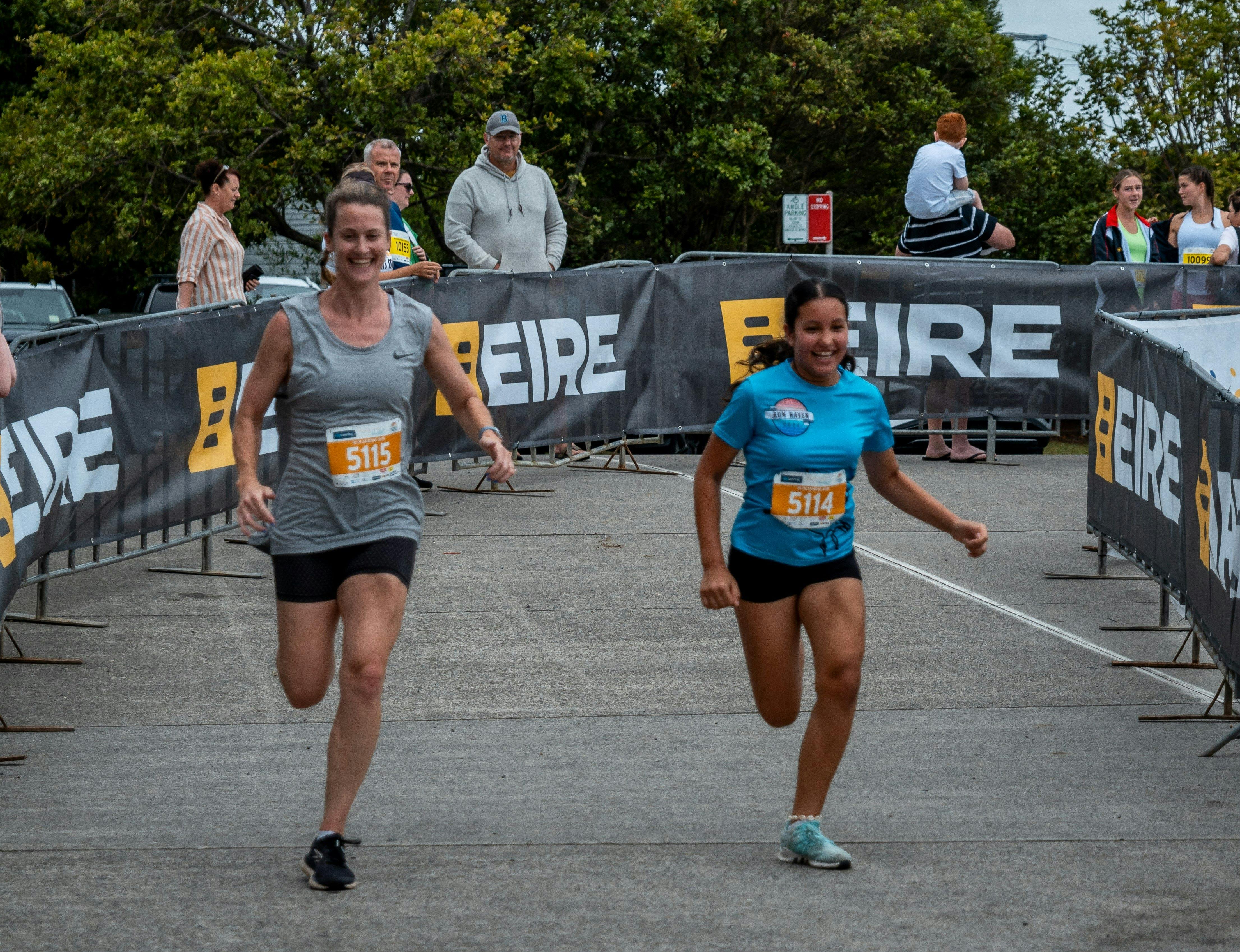 Two women on the finish line.