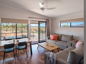 Open plan living and dining area of superior holiday units