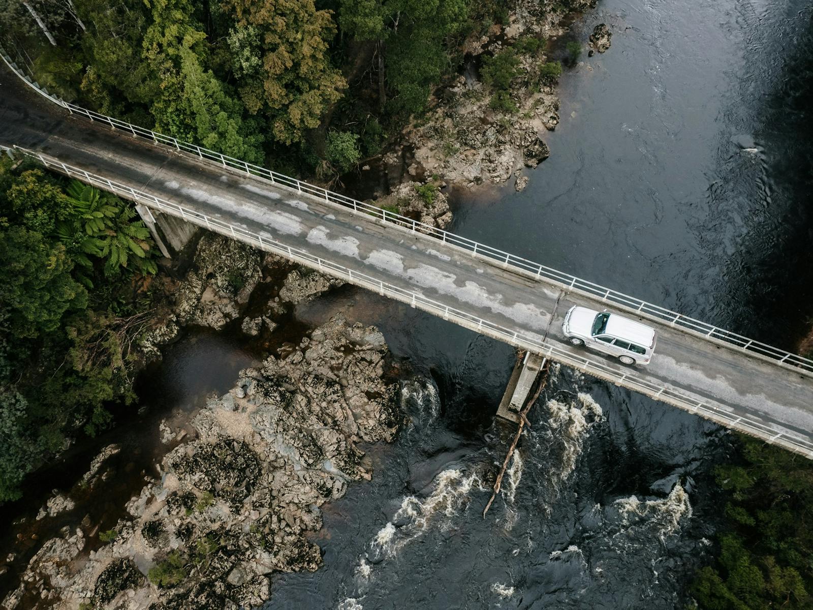 Aerial shot of the vehicle driving across the Arthur River