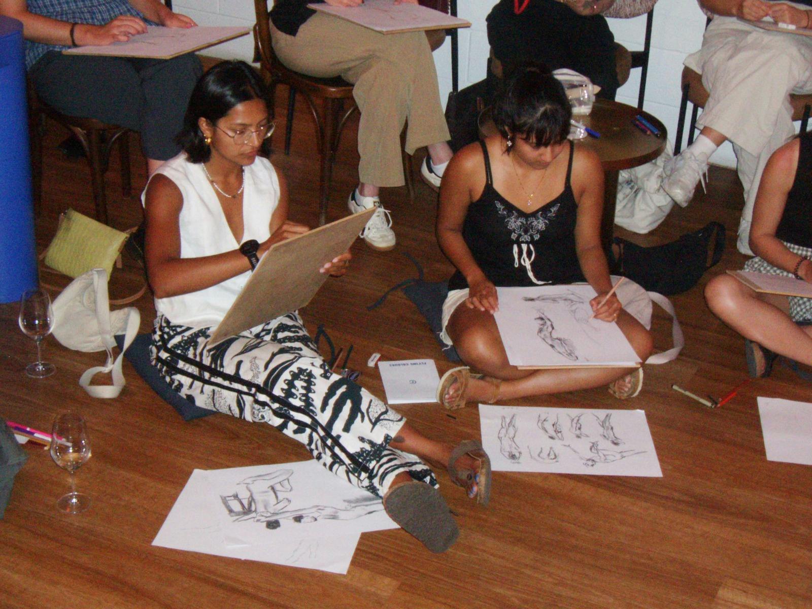 Two people drawing