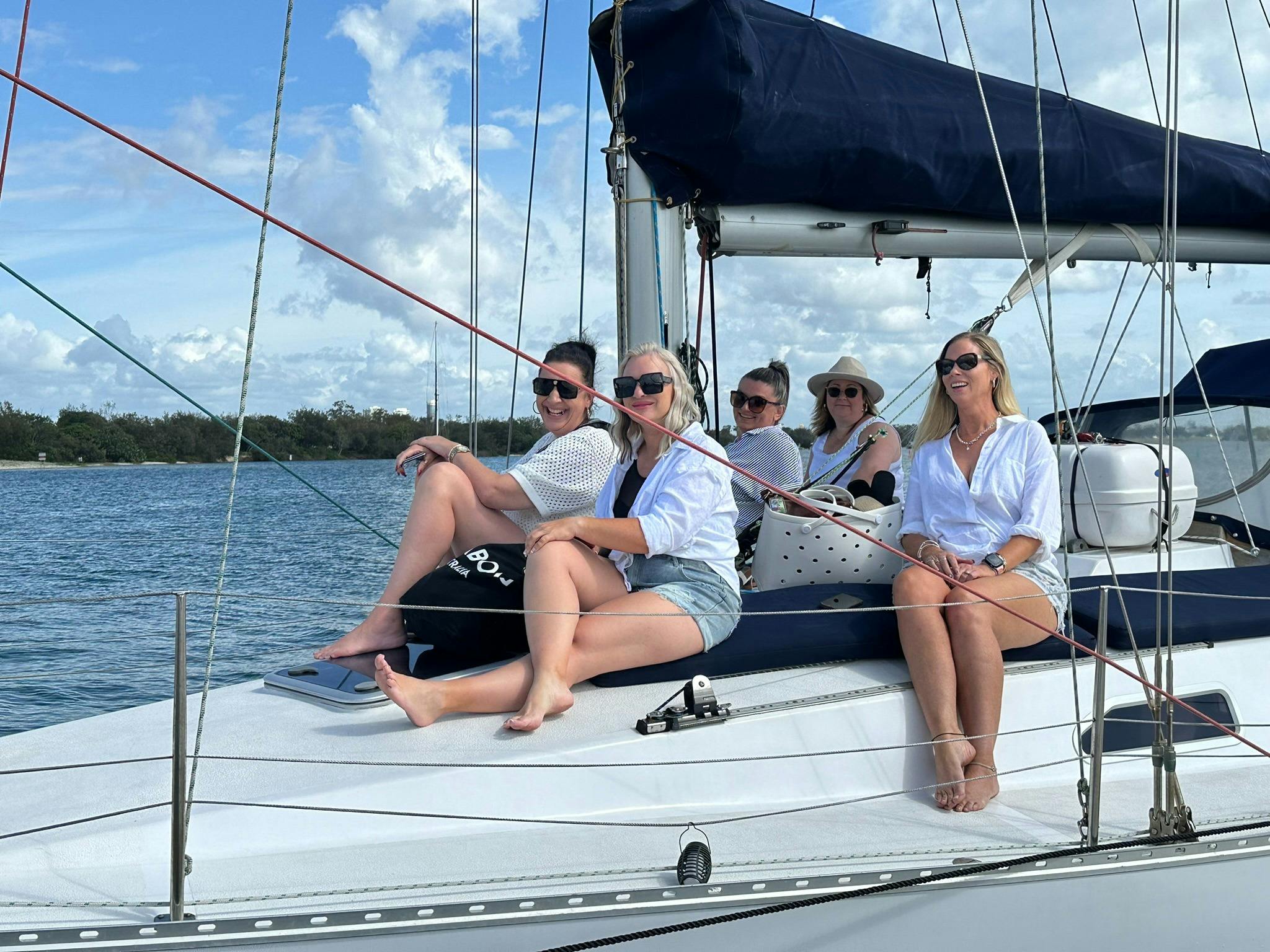 Five women friends spending time on Sun Sailing afternoon cruise Five women friends spending time on Sun Sailing afternoon cruise
