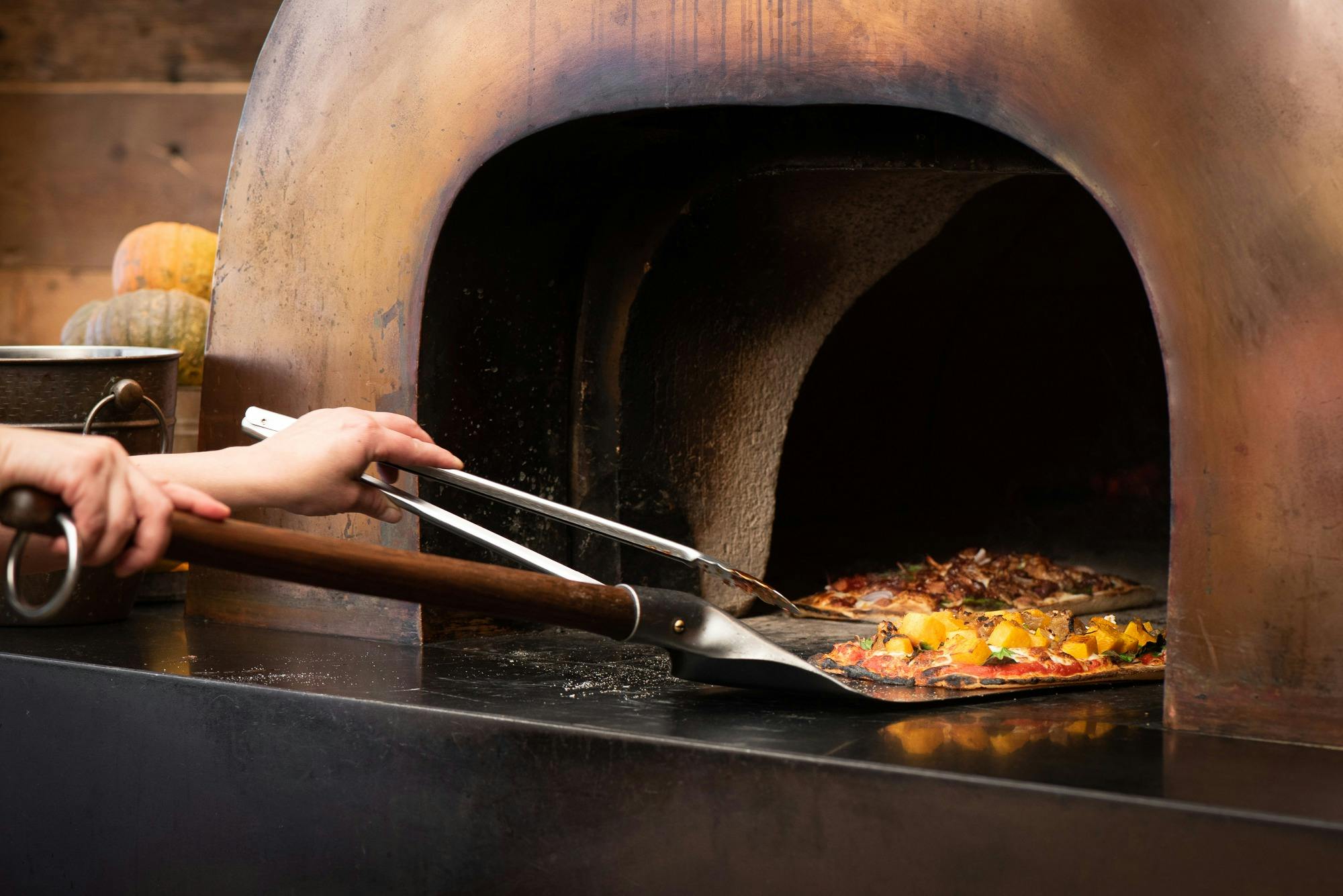 Our famous wood fired pizzas are available on our menu