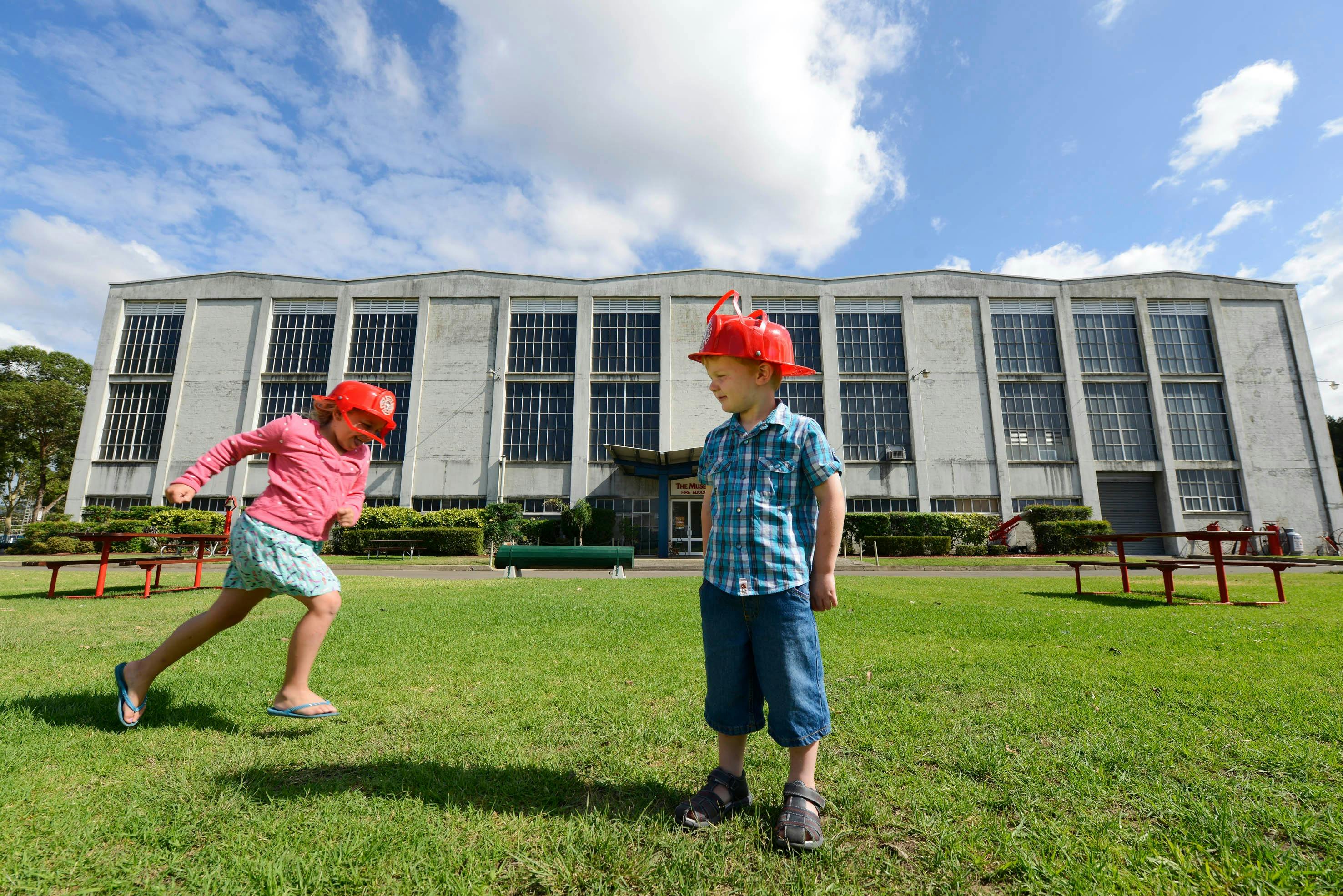 2 children on the grounds playing outside of the Museum
