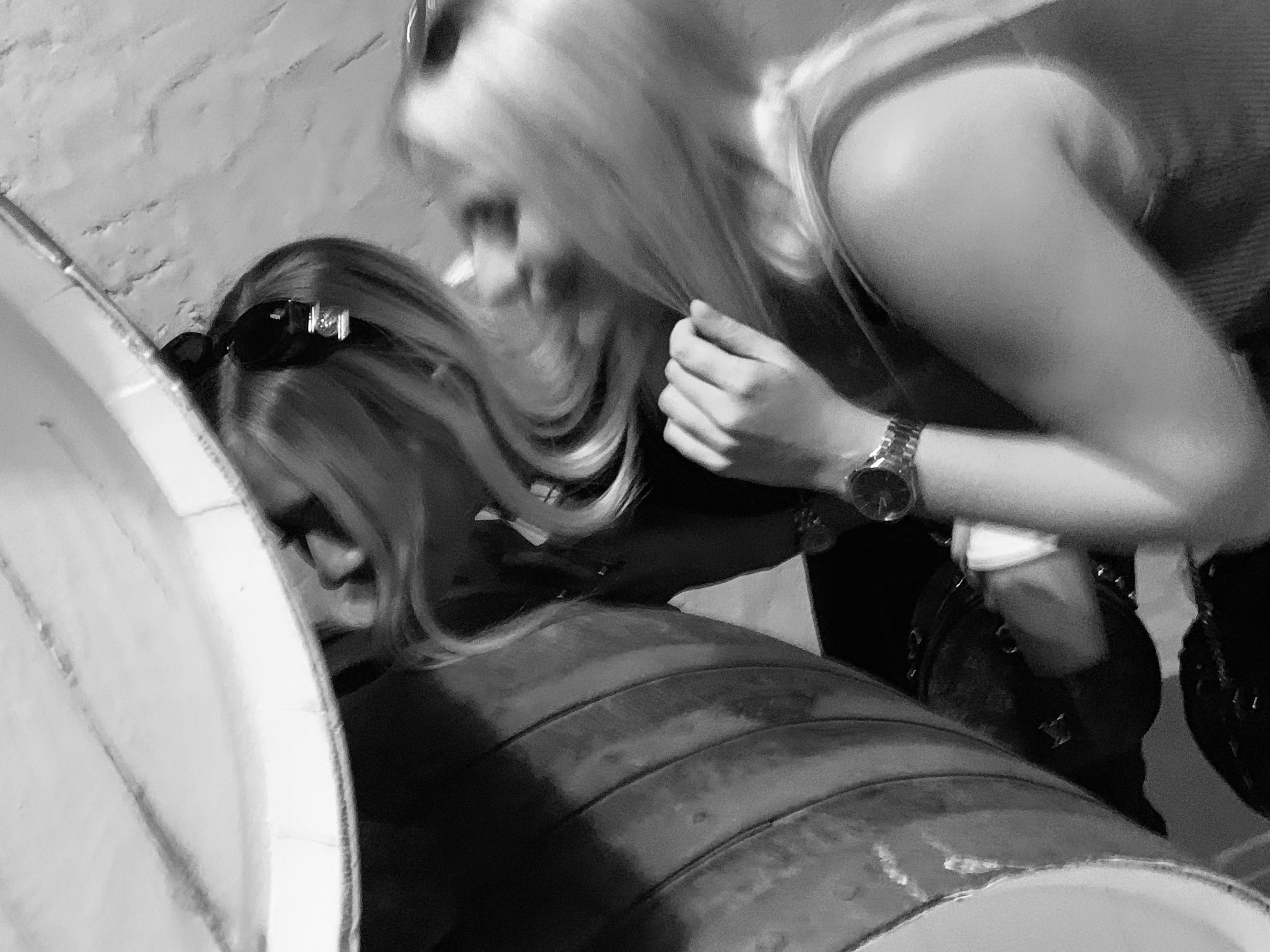 Wine tasting from the barrel, here two ladies smelling the wine from the barrel