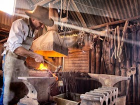 Lucky tour guests will find a fire in the forge and hear the hammer ringing on the anvil.