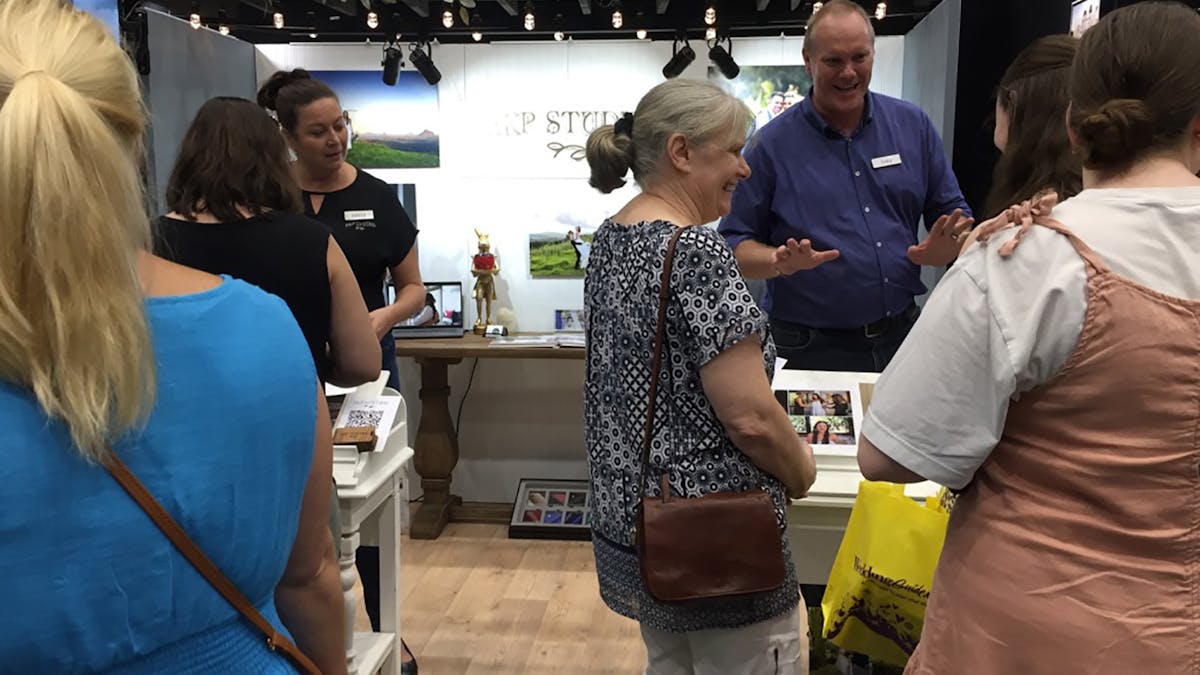 Couples meeting quality exhbitors at Your Local Wedding Guide Gold Coast Expo.