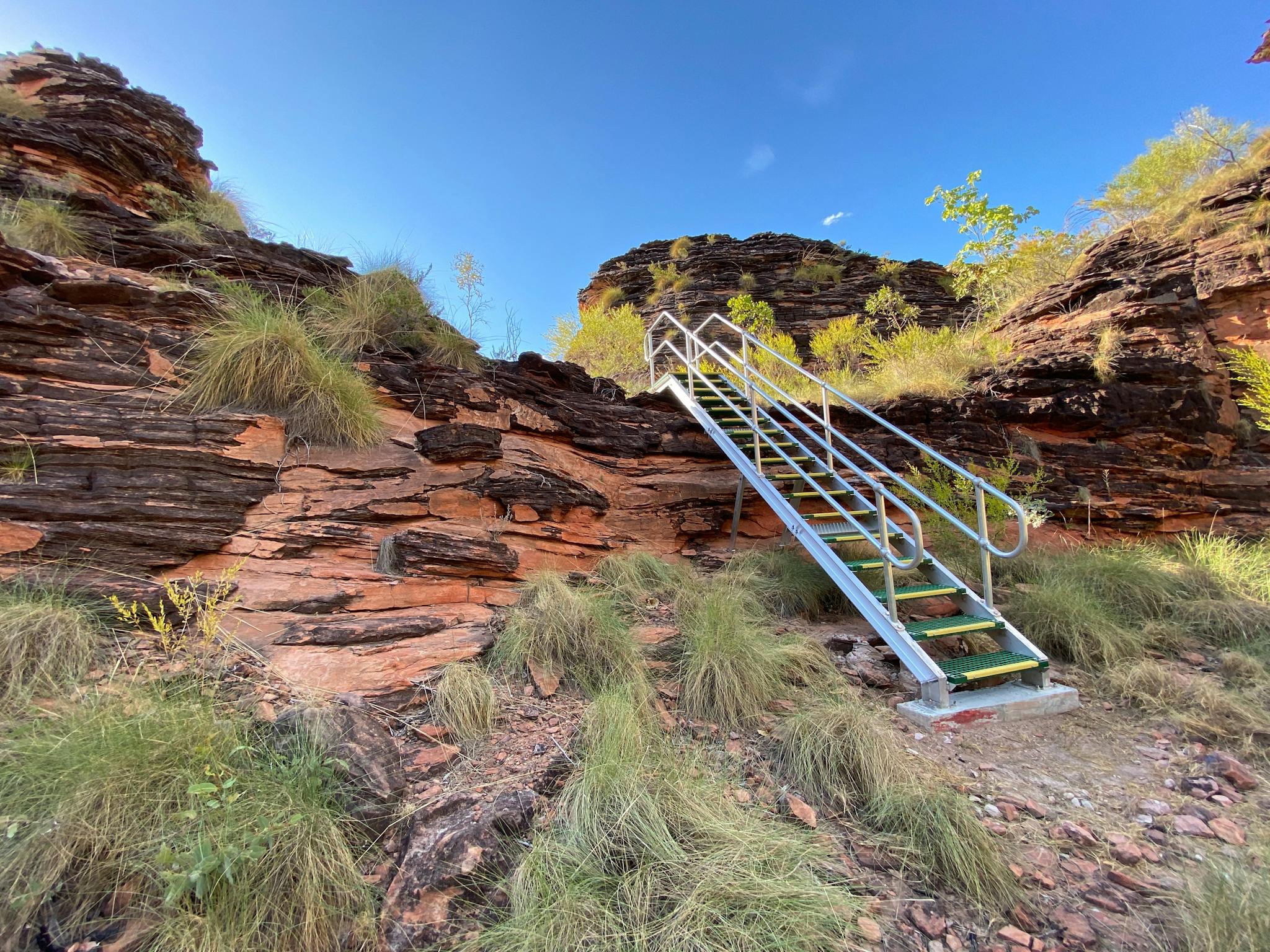 Metal staircase leading up to a view point.
