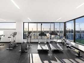 Rooftop gymnasium showing treadmills and other exercise equipment