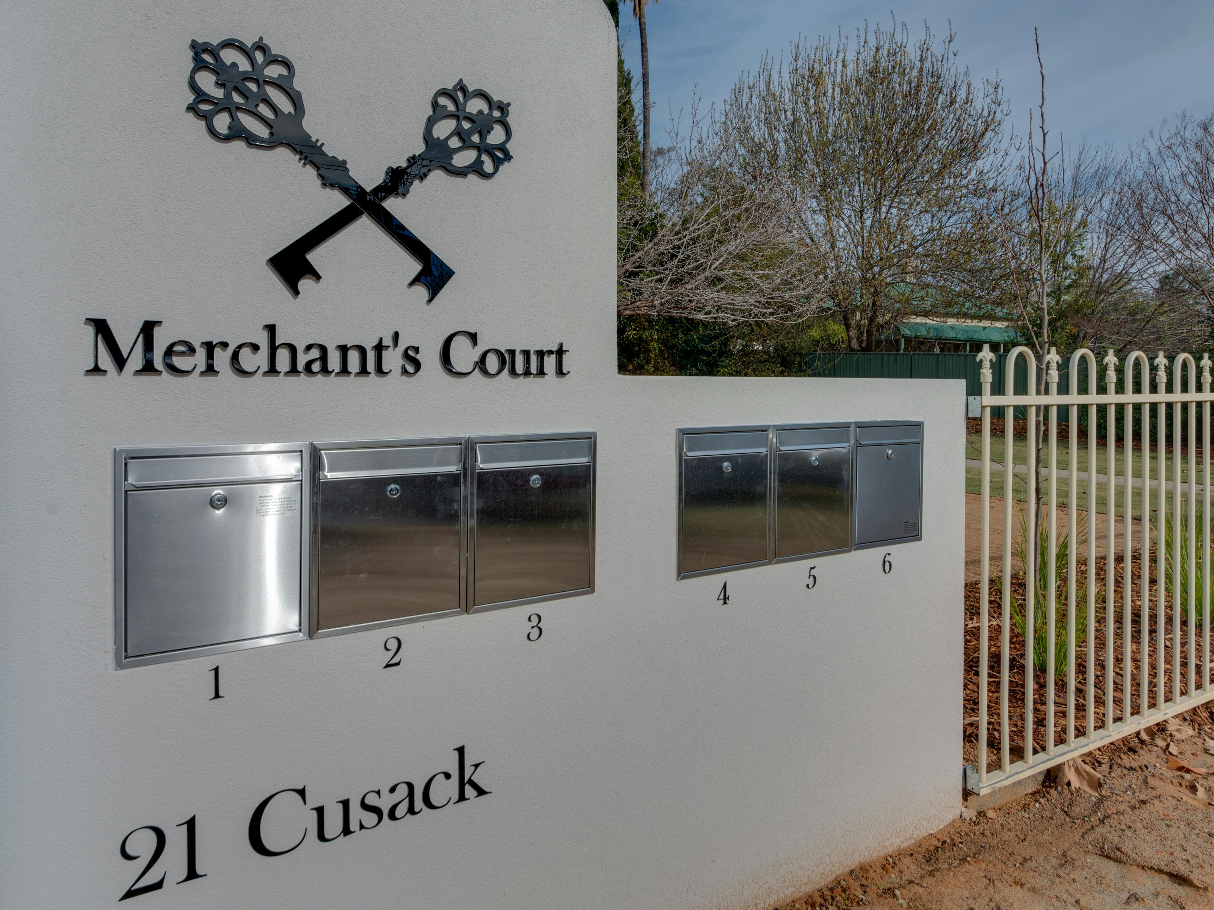 picture of mailbox with Merchants court on the front