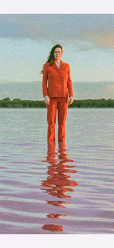 Photo of two women standing in shallow water