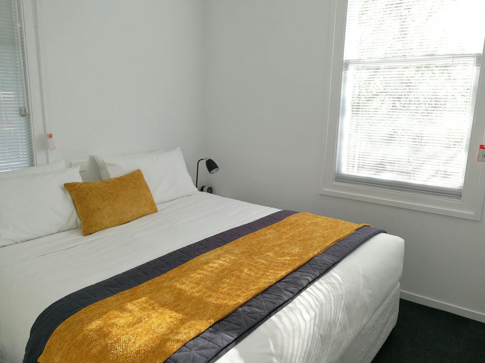 Second bedroom configuration: king bed (shown) or two single beds.