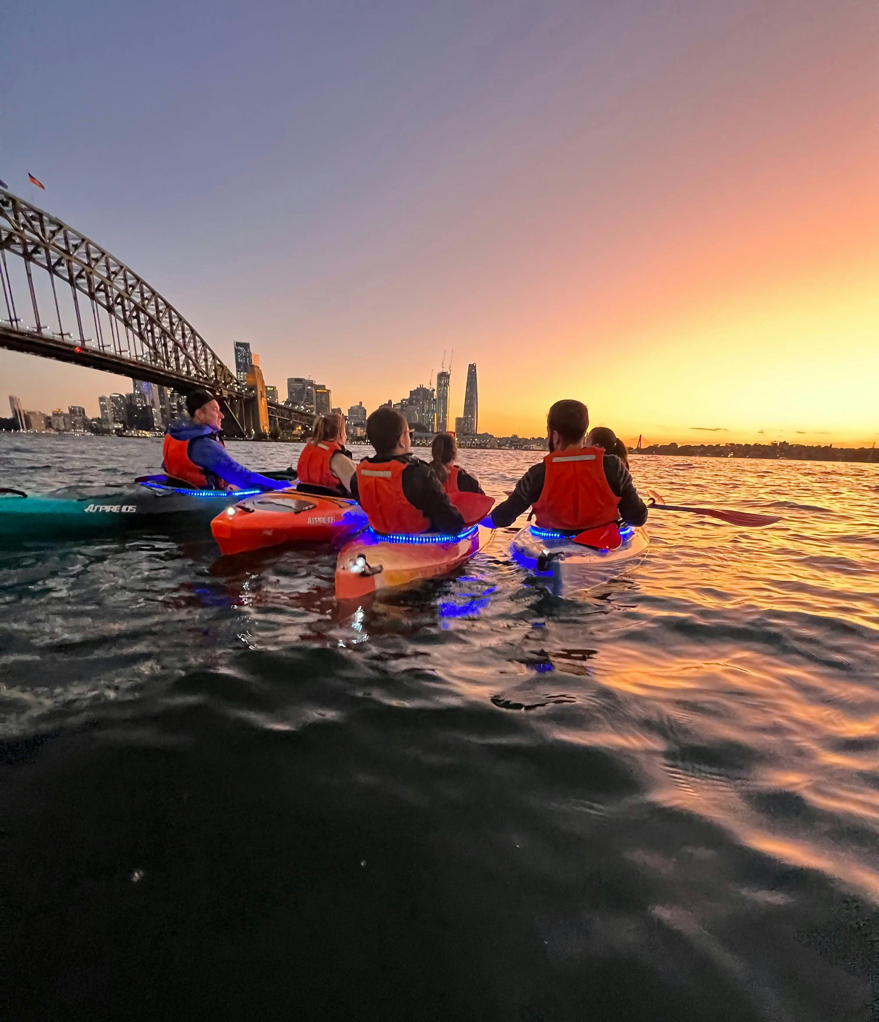 Huddling together to take in the stunning dusk colours of Sydney Harbour