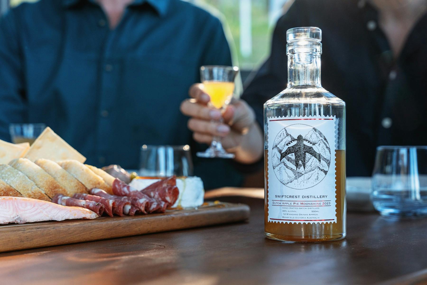 Swiftcrest Distillery apple pie moonshine with grazing platter and cocktails.