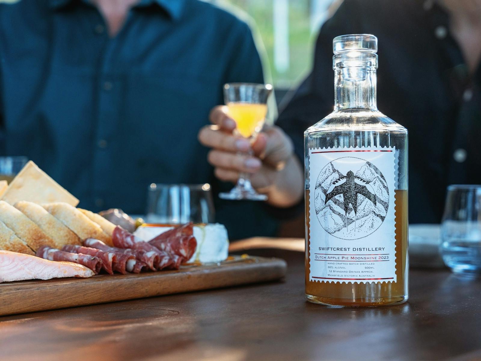Swiftcrest Distillery apple pie moonshine with grazing platter and cocktails.