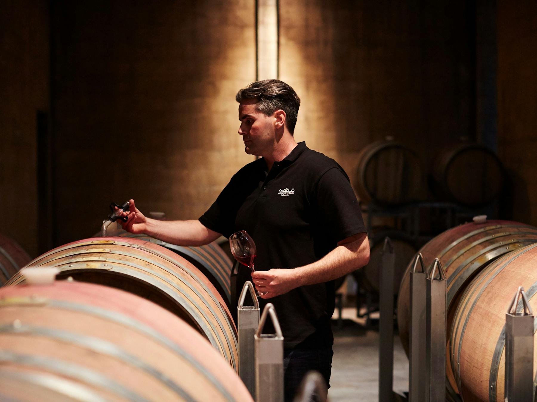Winmaker and barrel in cellar