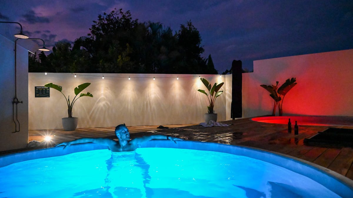 Guest relaxing in the cold magnesium pool at night