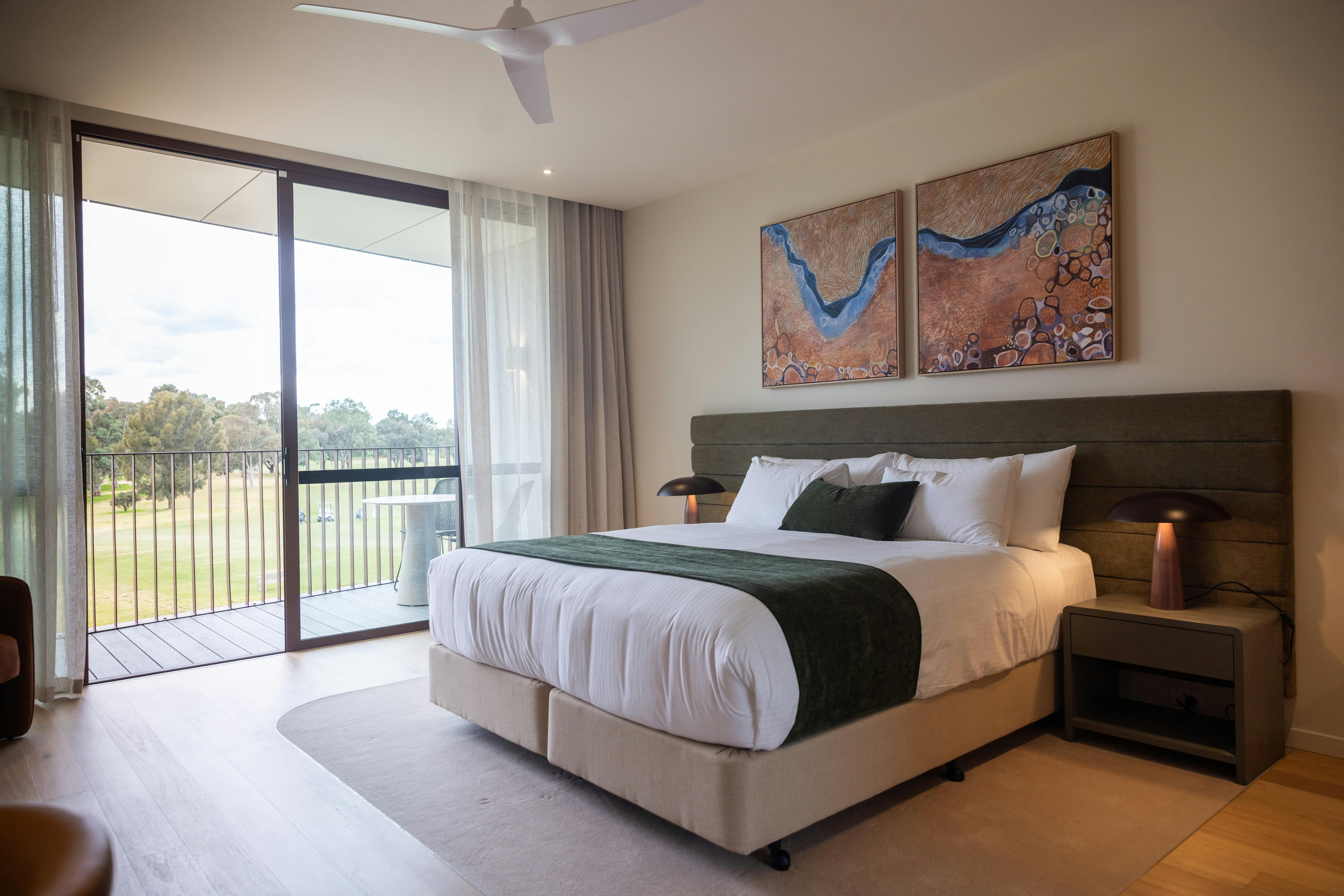 Contemporary studio room at Reflections  featuring a comfortable bed and views of golf course