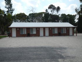 Modern brick ensuite cabins with a queen size bed, fridge, microwave, toaster and kettle, A/c & TV.