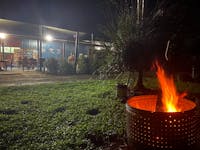 View of Daintree Siesta Restaurant showing campfire on lawn