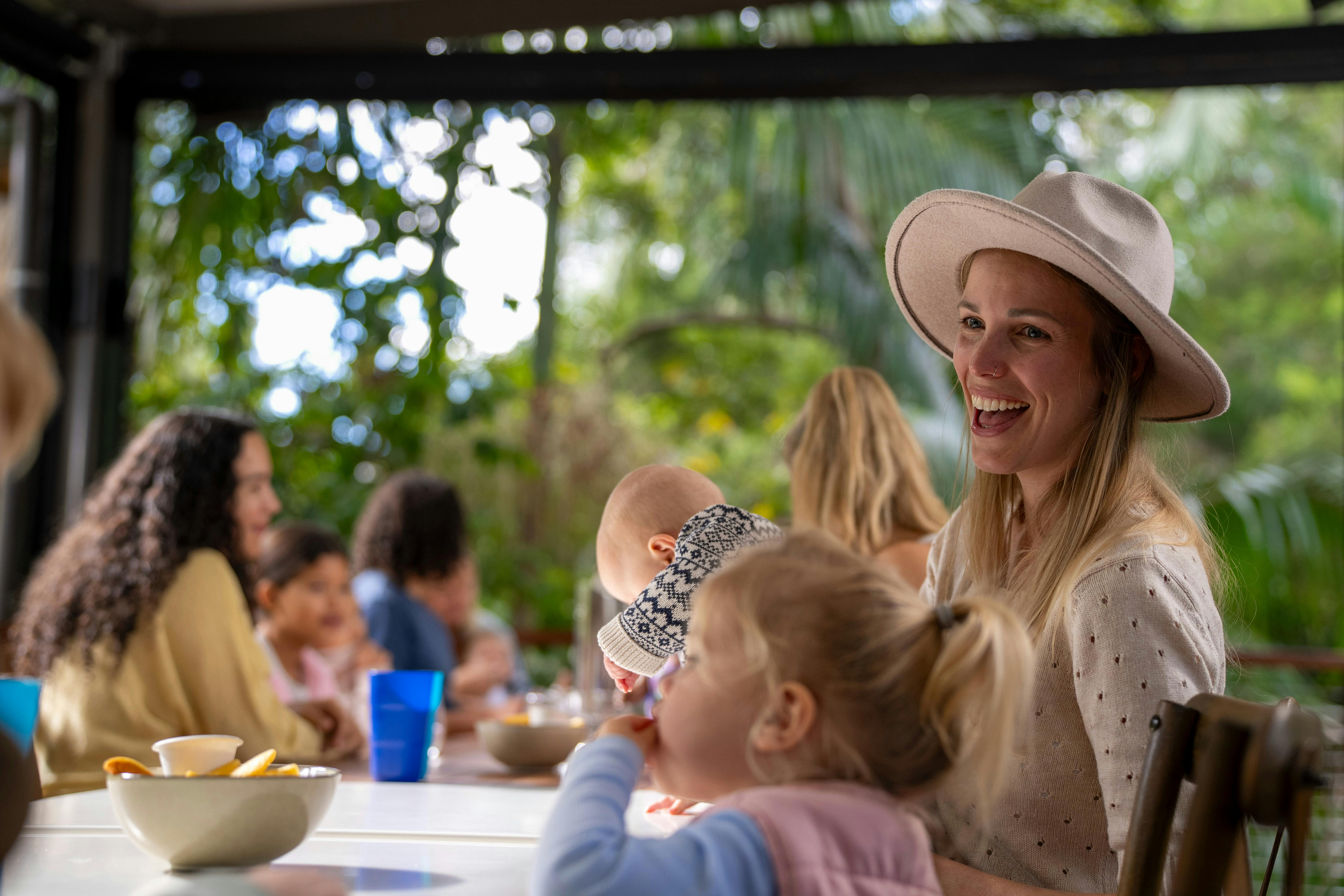 Families enjoying food and drinks in the cafe.
