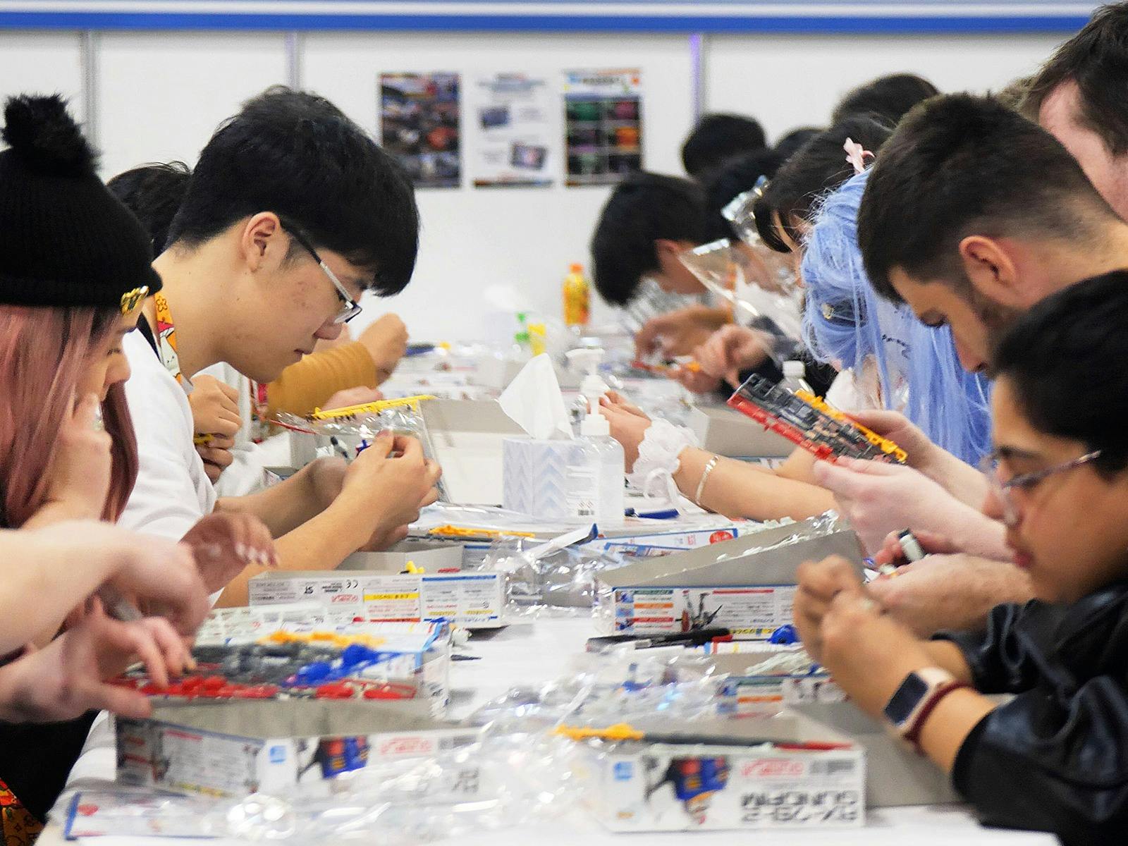 Children and families taking part in the free Gunpla workshop at the Gundam Base Pop-Up World Tour S