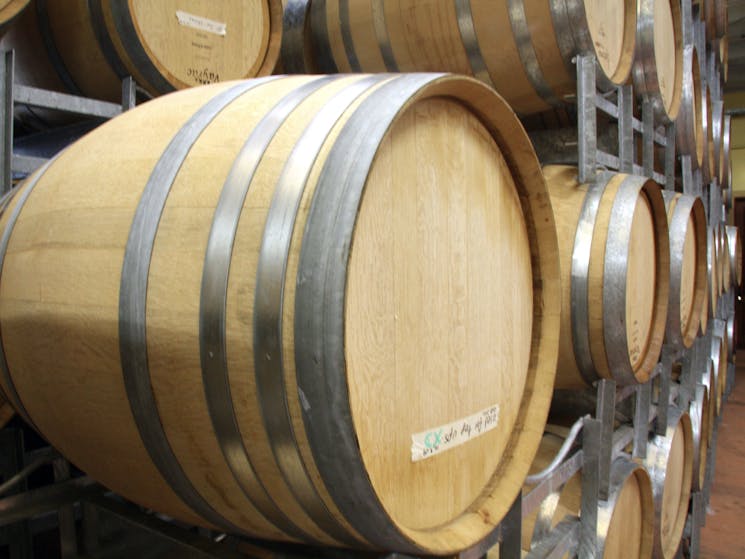 The wine barrels are stack as the wine ages gracefully