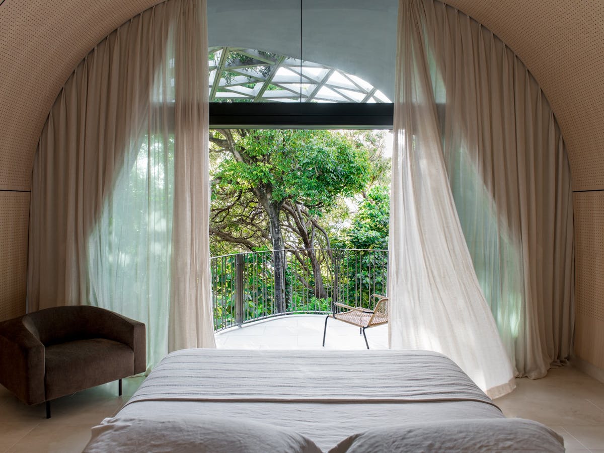 Spacious master bedroom overlooking lush Noosa National Park at Domic Noosa
