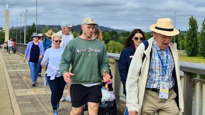 a group of people of various ages walking