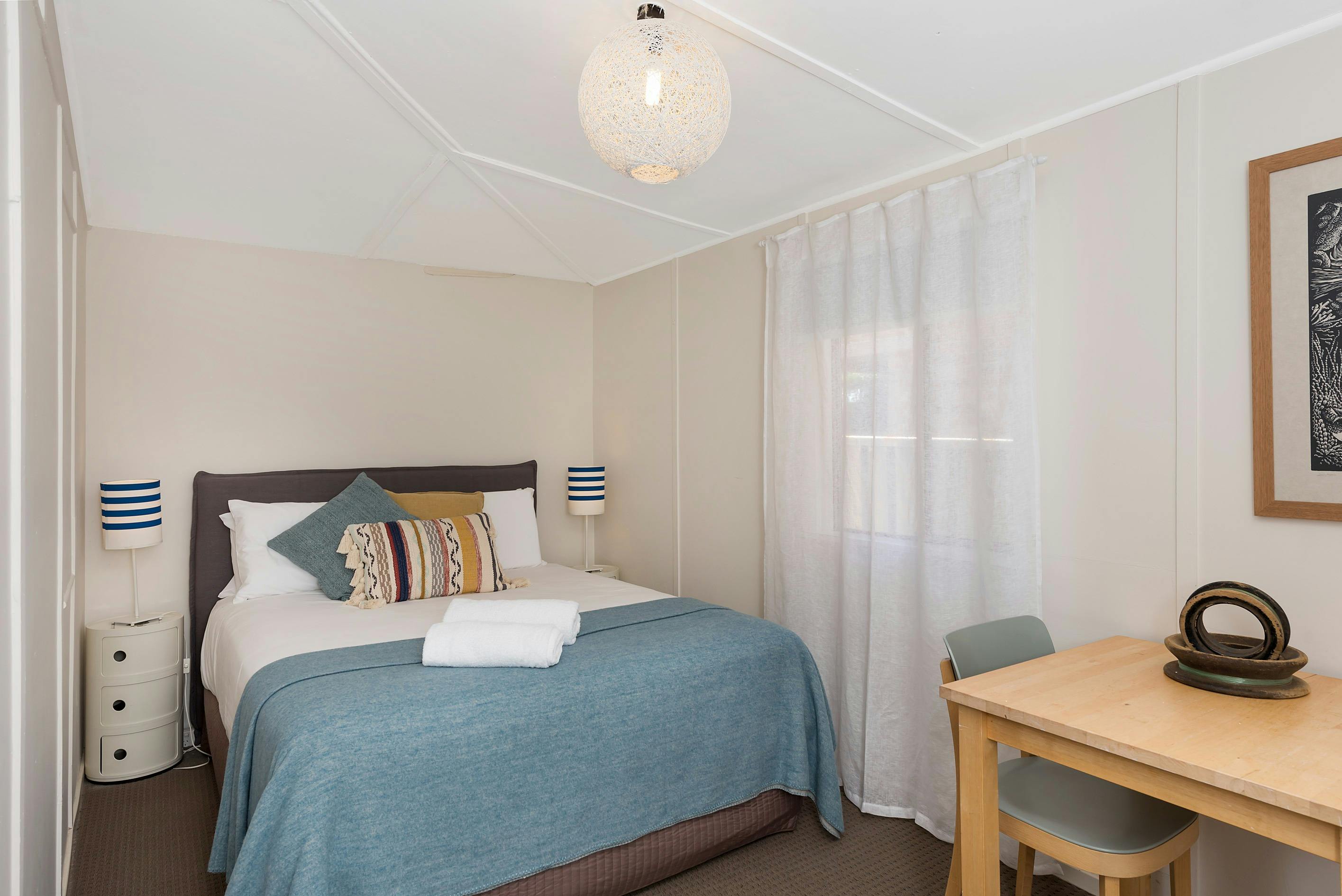 Second Bedroom with Queen bed and desk.