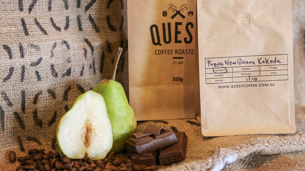 PNG Kokoda single origin medium roast. Vibrant, unique, with cocoa, green pear, and mandarin.
