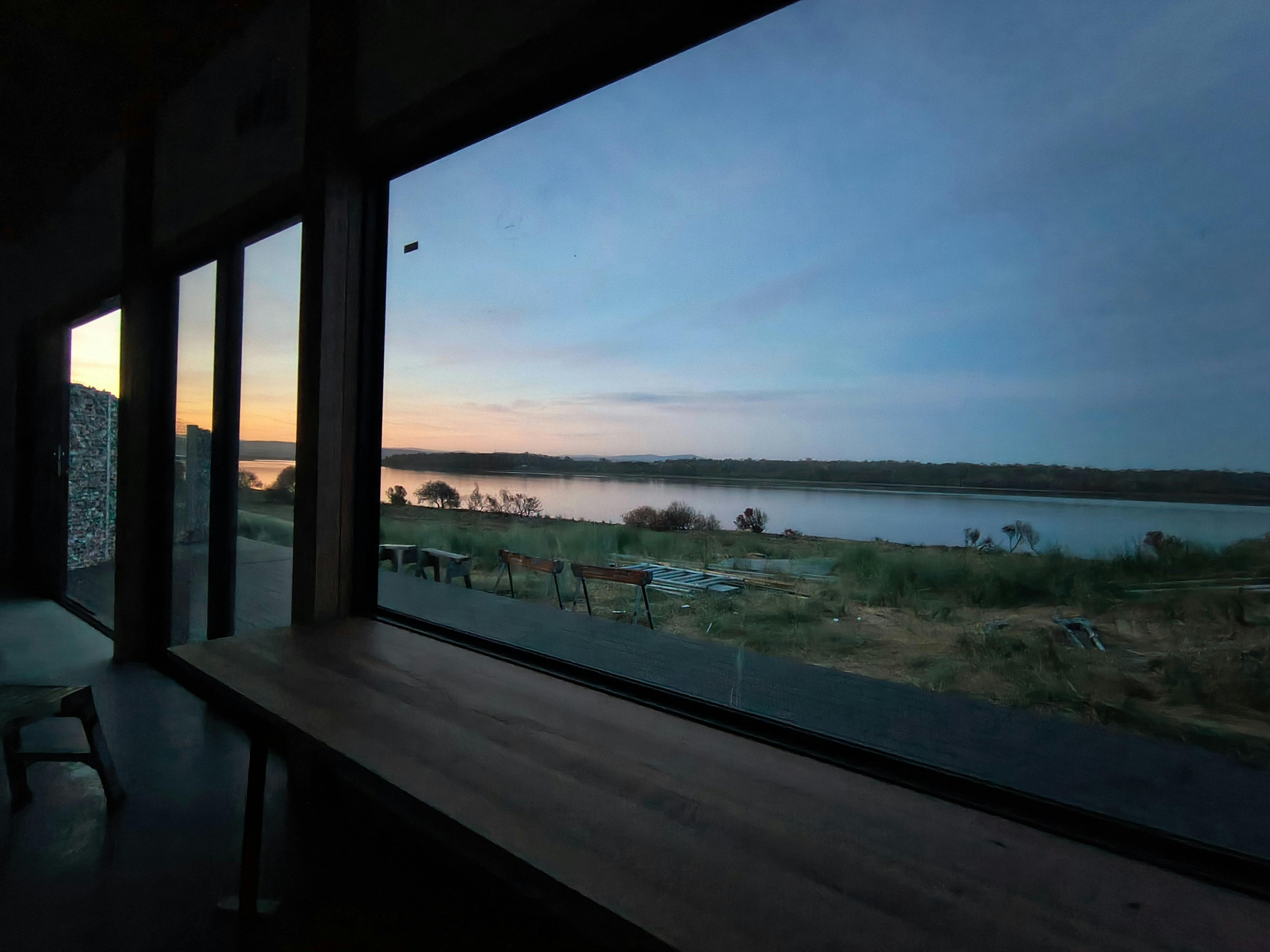 The bearutiful calm Swan River is captured at sunset from the desk at Sands Shacks Dolphin Sands