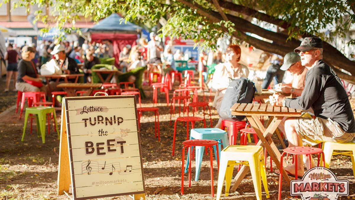 A photo of milton markets seating area under trees