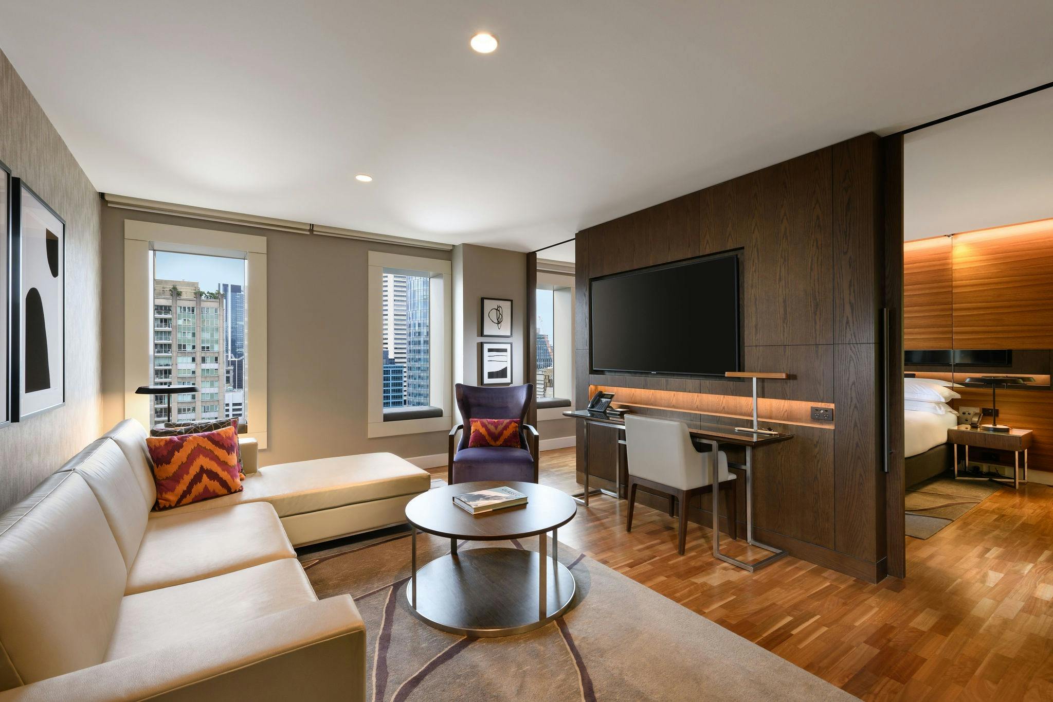 Image from the living area of the City View Suite at Hilton Sydney, with the bedroom featured
