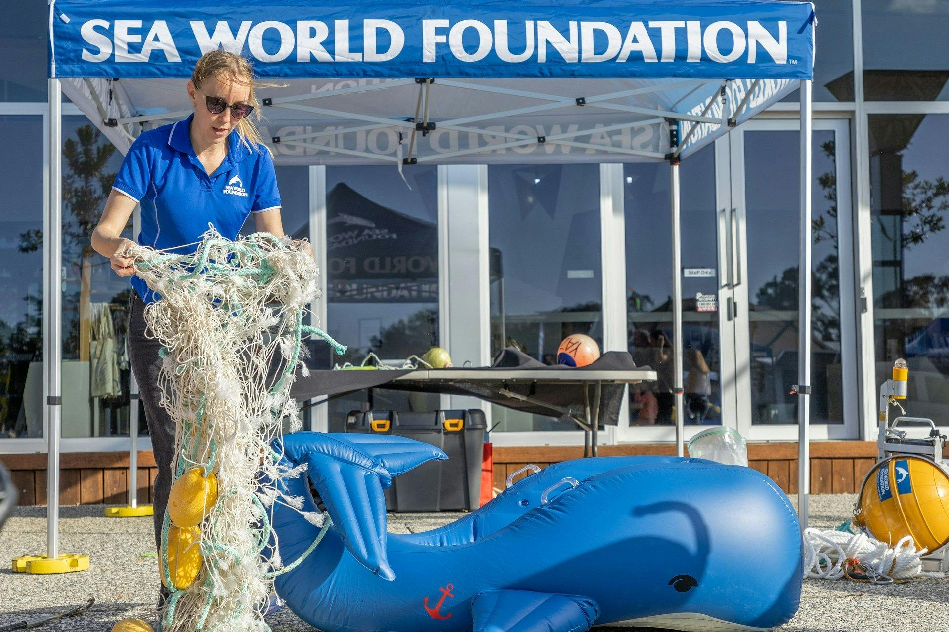 Sea World Foundation educating patrons how to safe whales trapped in nets.